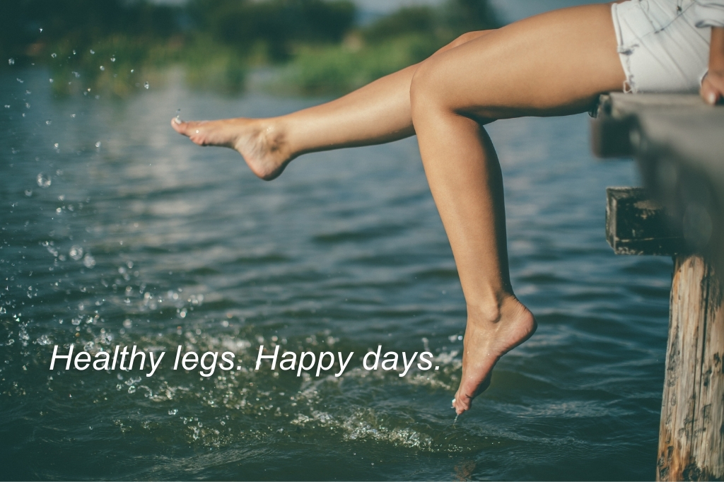 Person relaxing by a lake after vein treatment in Lake Oconee | The Vein Guys board-certified vein specialists.